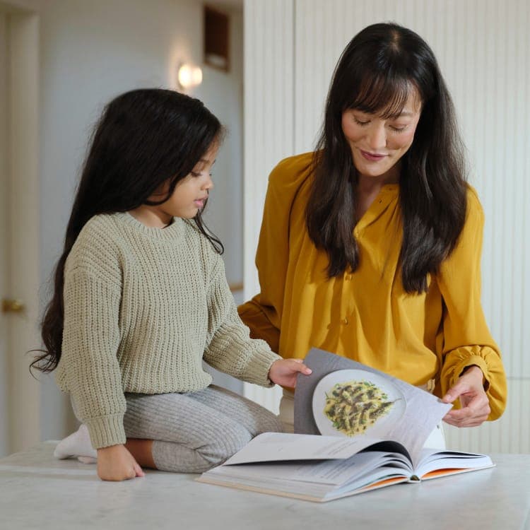 Woman with Daughter Reading Menopause