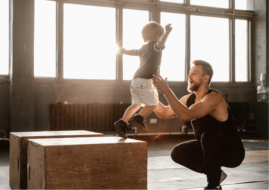 Child jumping to man
