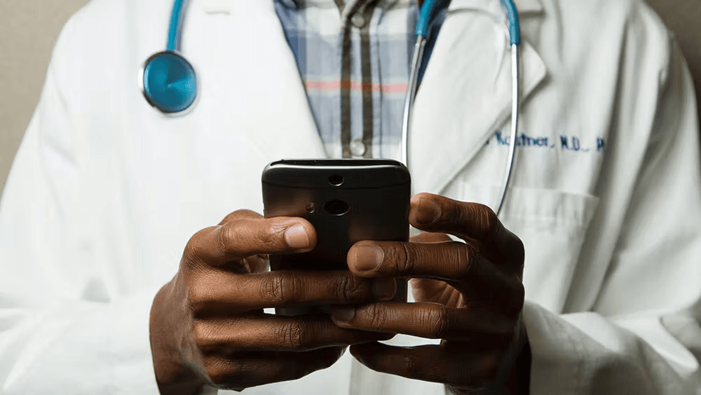 Doctor holding cellphone