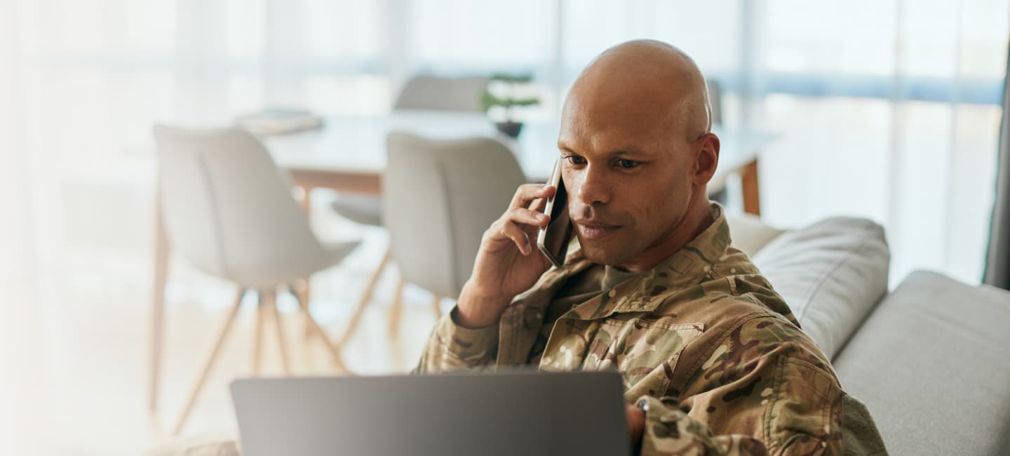 man-on-phone-and-computer