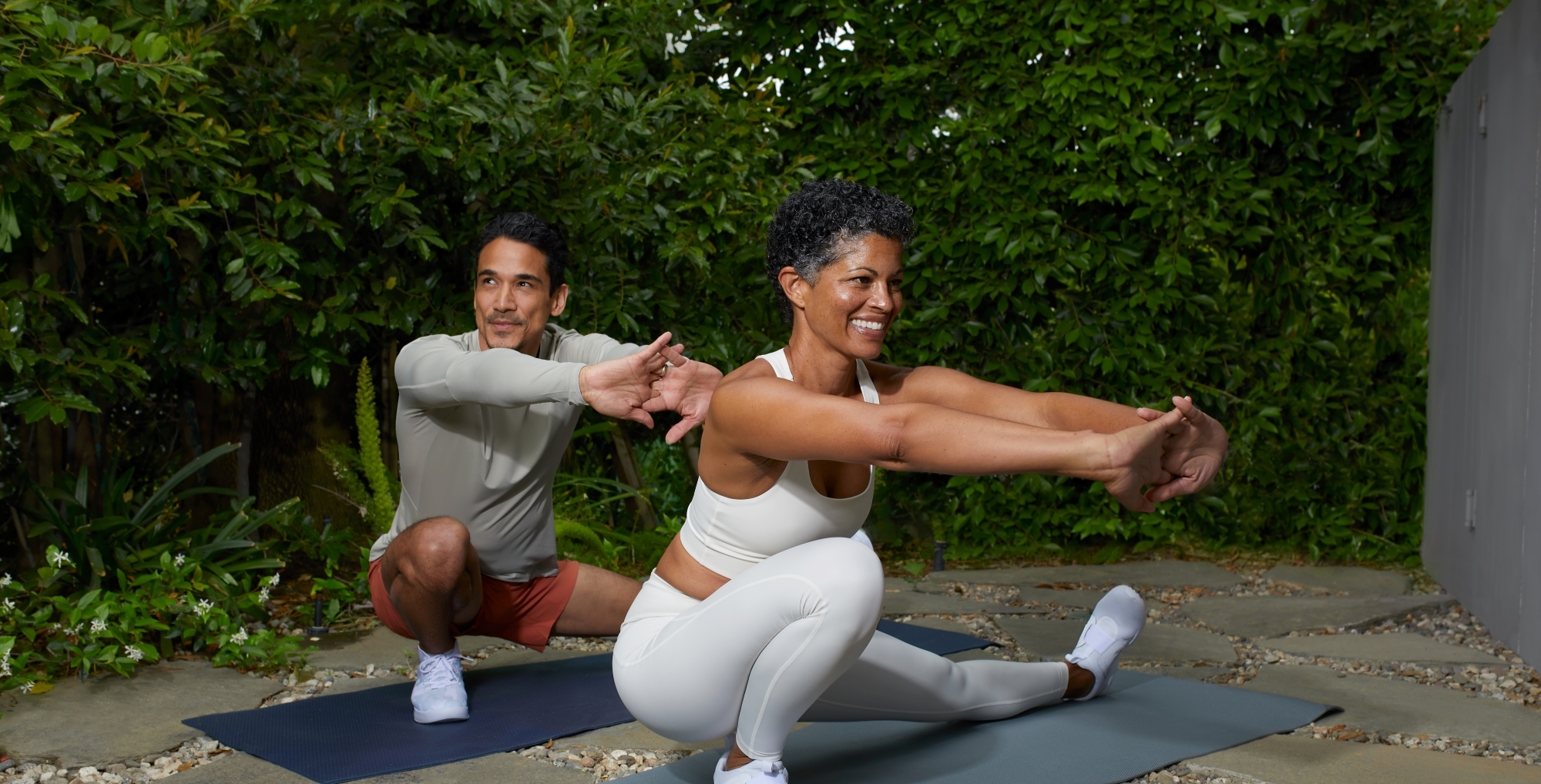 Man and woman doing yoga