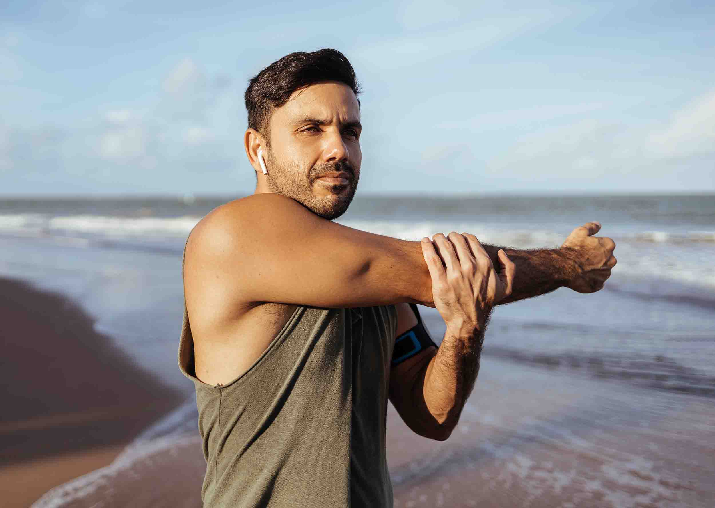 Lifeforce Get Started Man on Beach Stretching