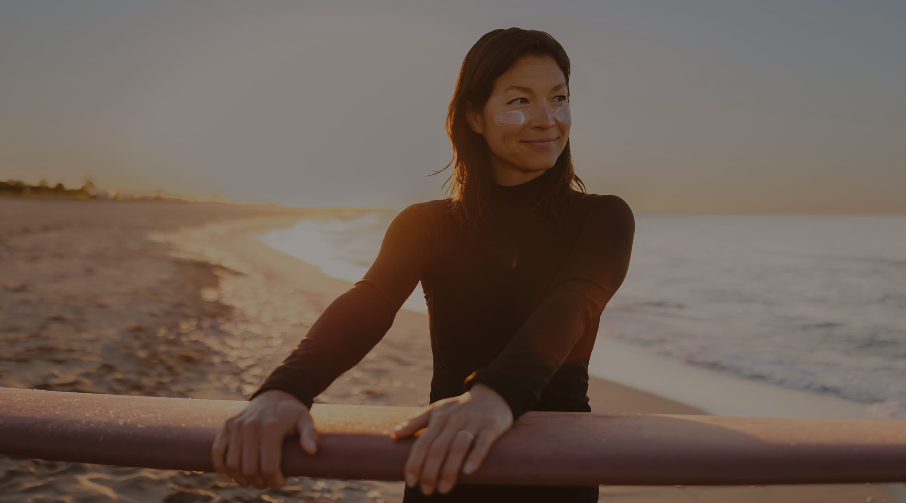 Woman holding a surfboard