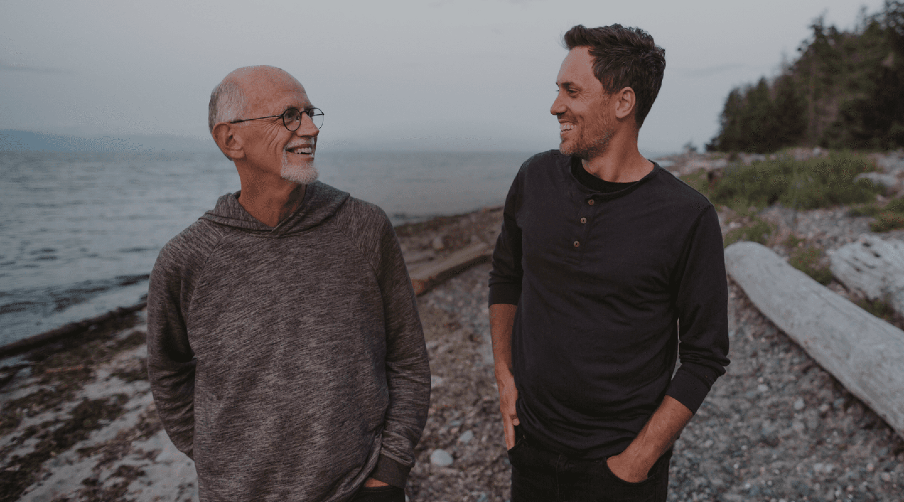 Image of two men walking on a beach