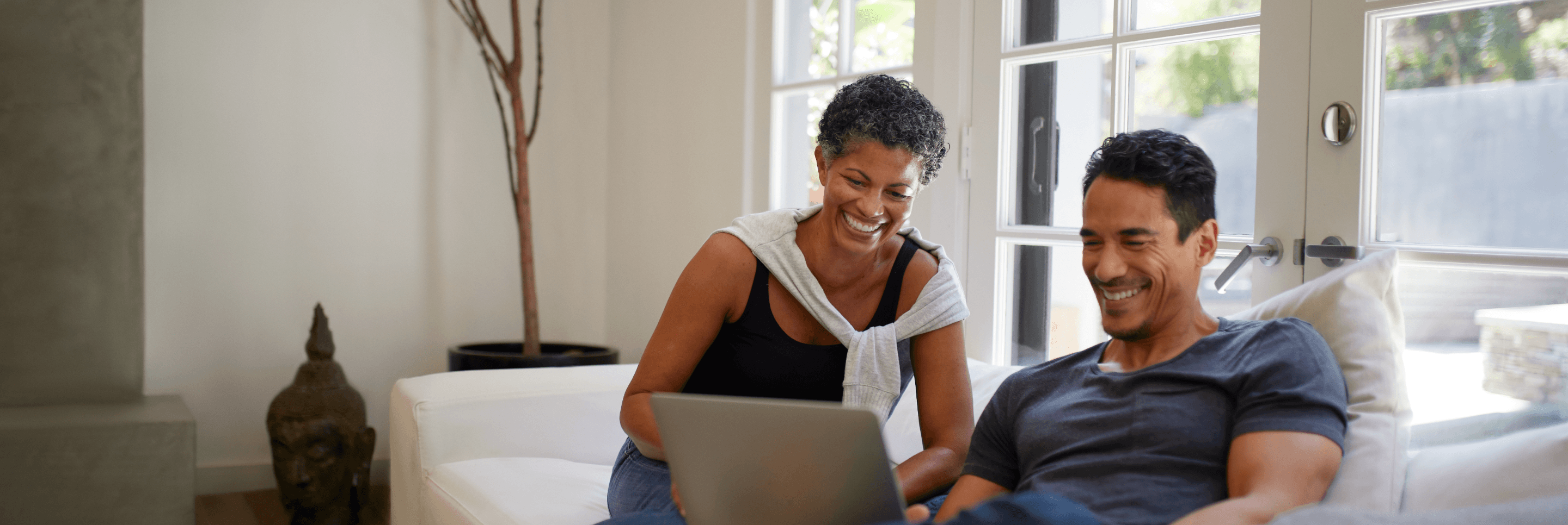 Man and woman looking at laptop