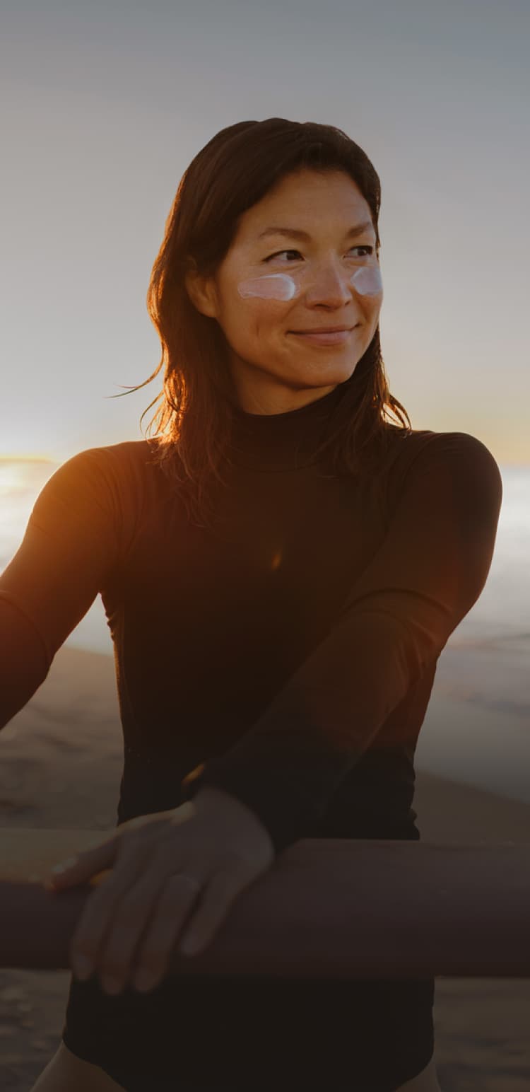 Woman holding a surfboard